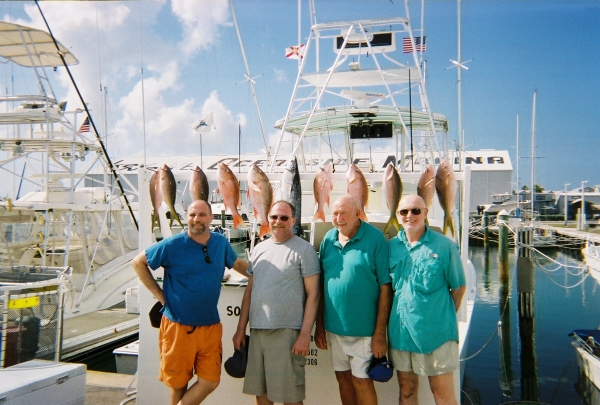 key west fishing charter posing with their catch
