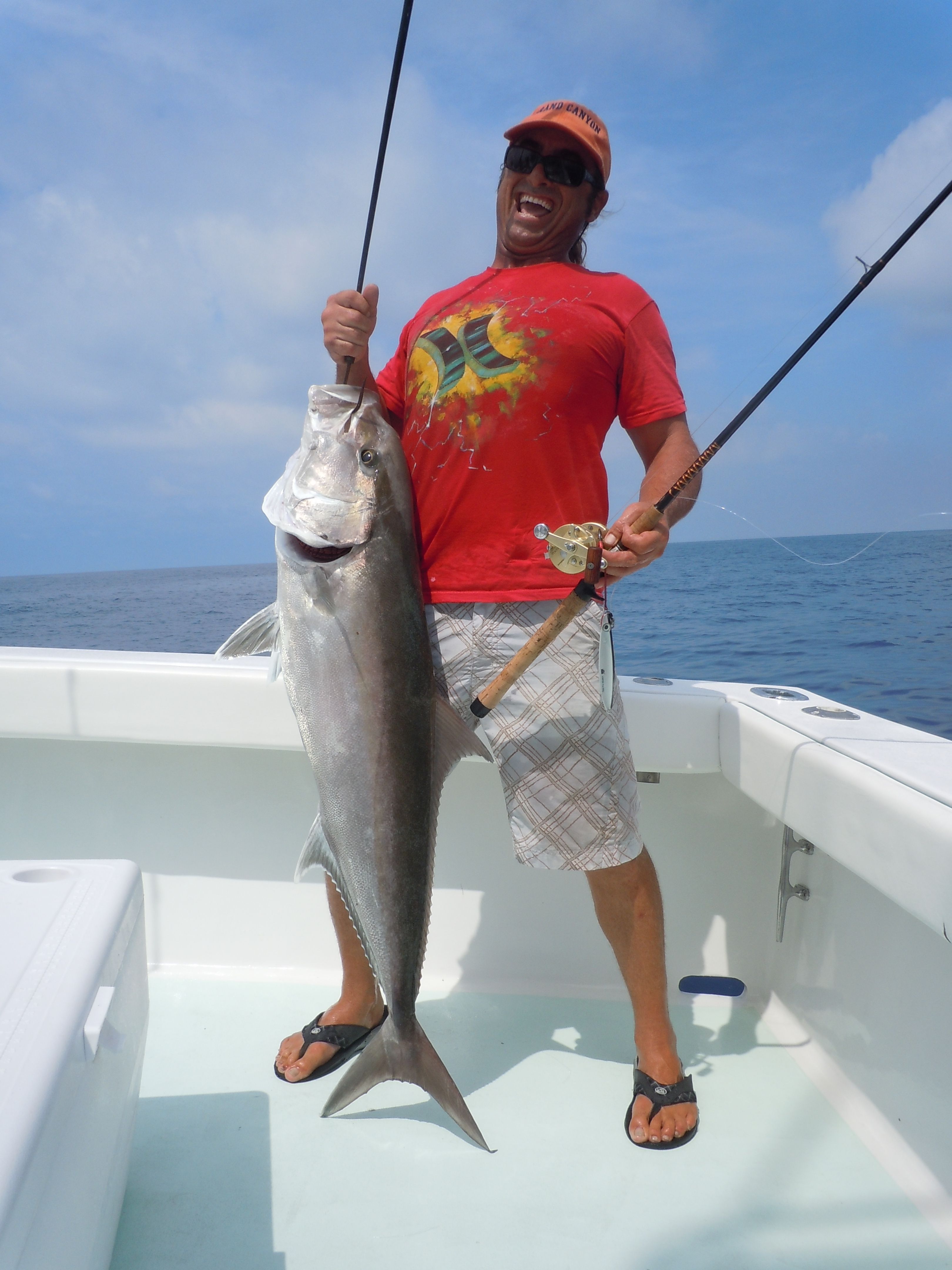 fishing mate holding greater amber jack