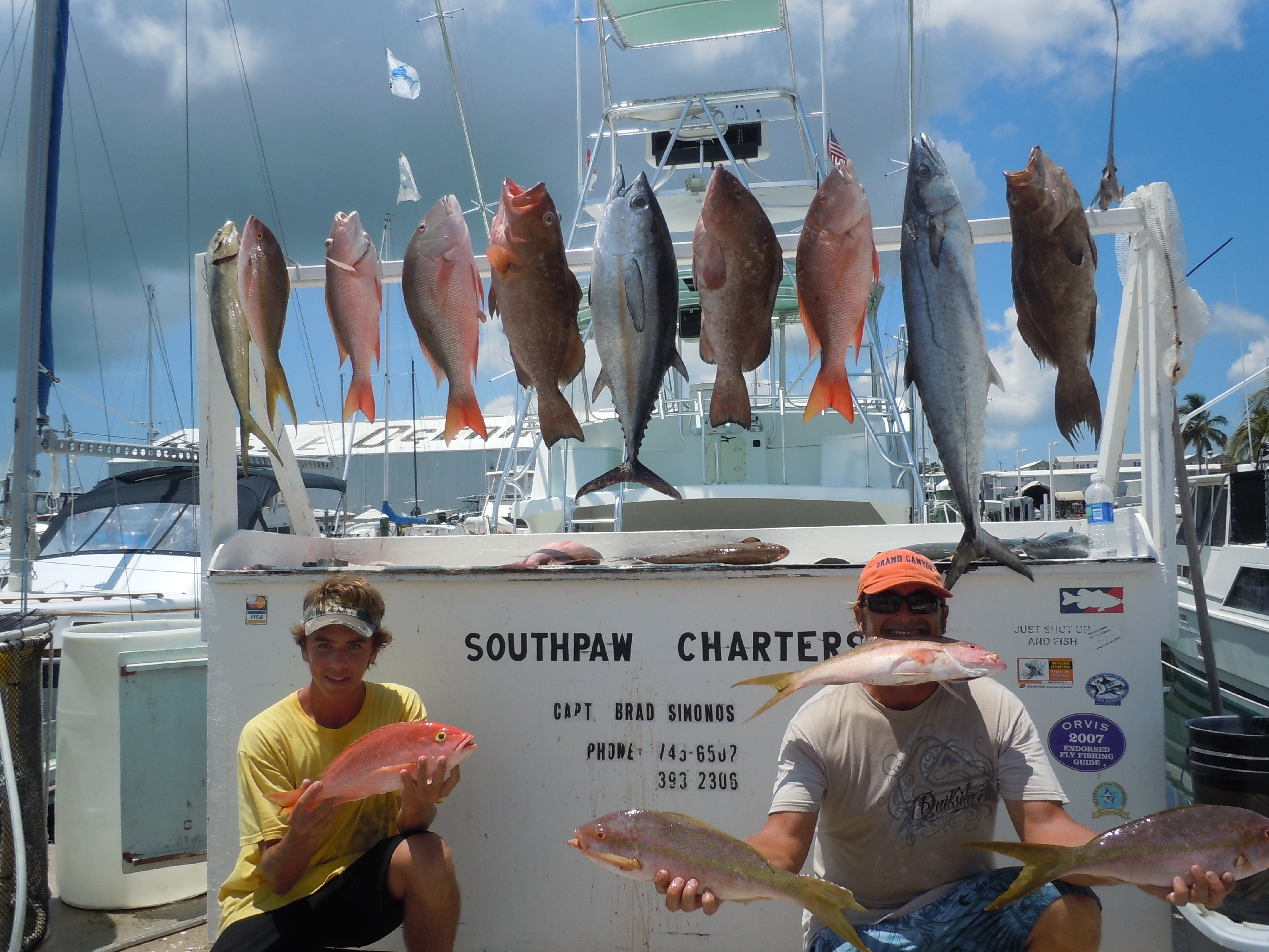 grouper, red, yellowtail, mutton snapper and a kingfish at the dock in key west