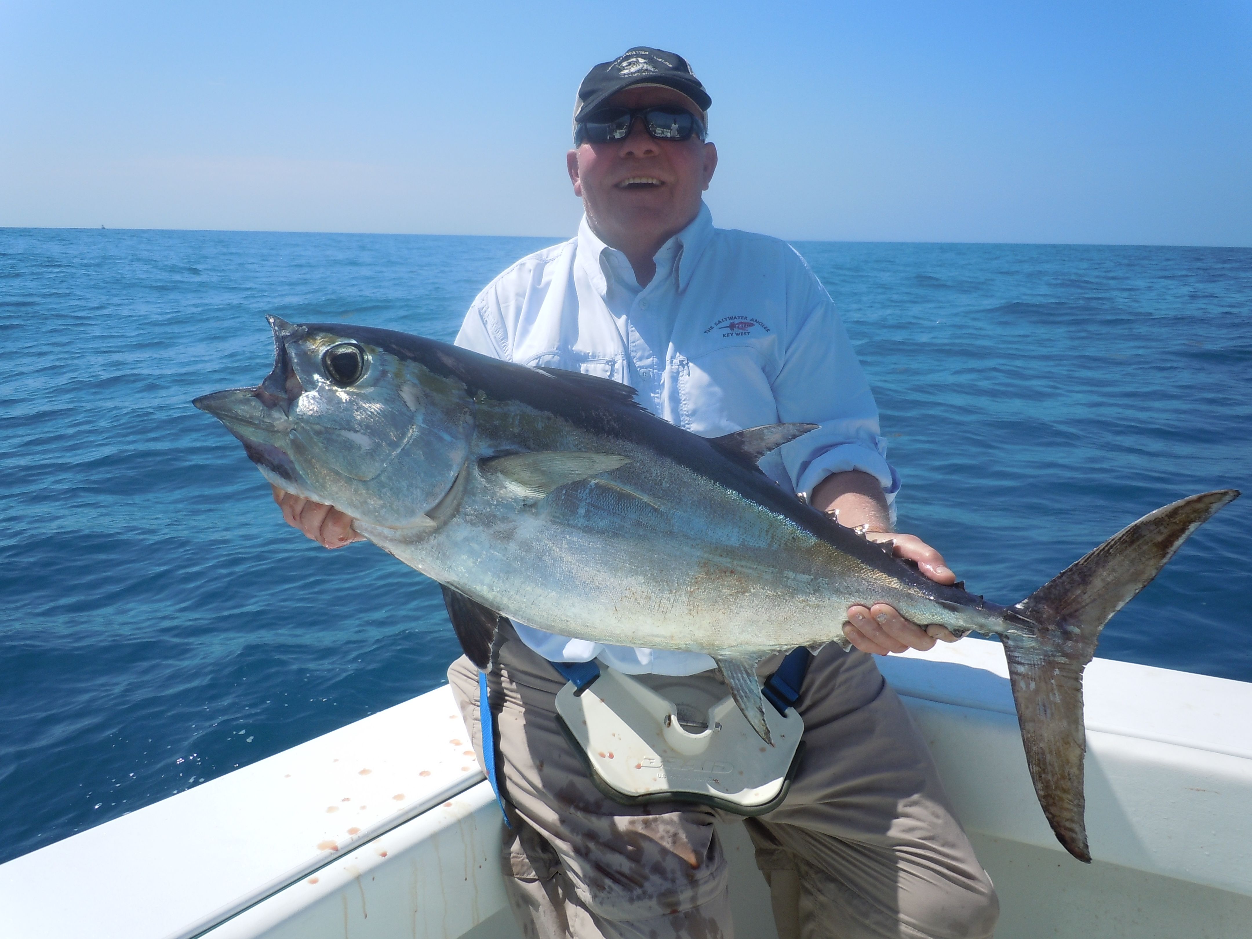Customer holding a nice black fin tuna in Key West