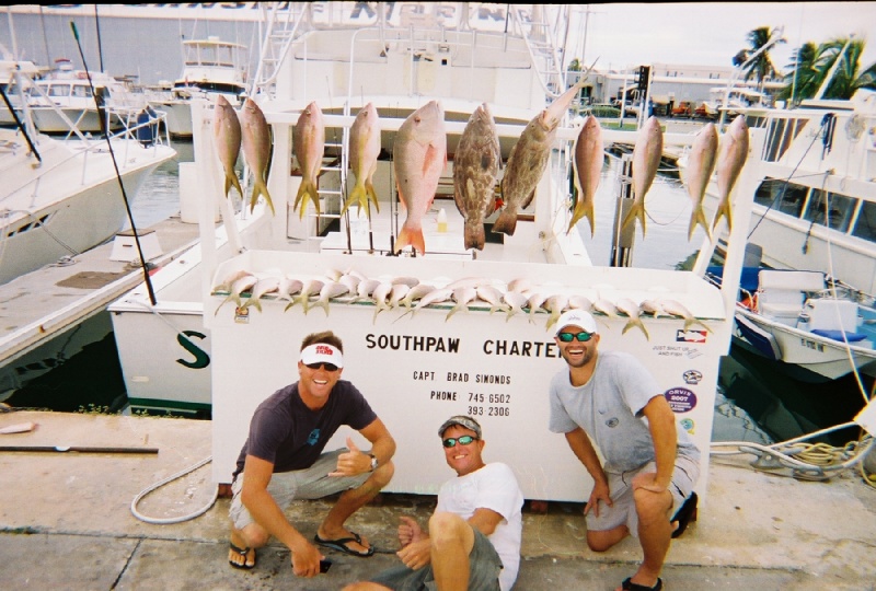 3 men and their catch from the southpaw in key west, fl