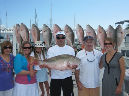 Group charter with 12 mutton snapper