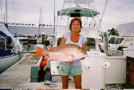 Woman holding a mutton snapper