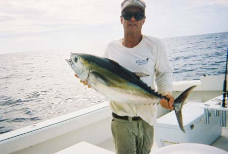 Captain Brad holding a nice tuna