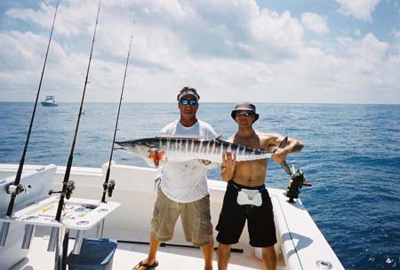 Mate and client holding a nice wahoo