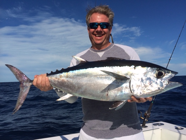 Man holding a tuna fish in key west